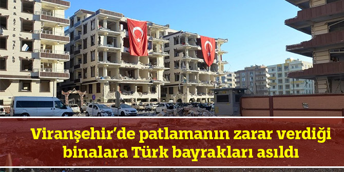 Patlamanın zarar verdiği binalara Türk bayrakları asıldı