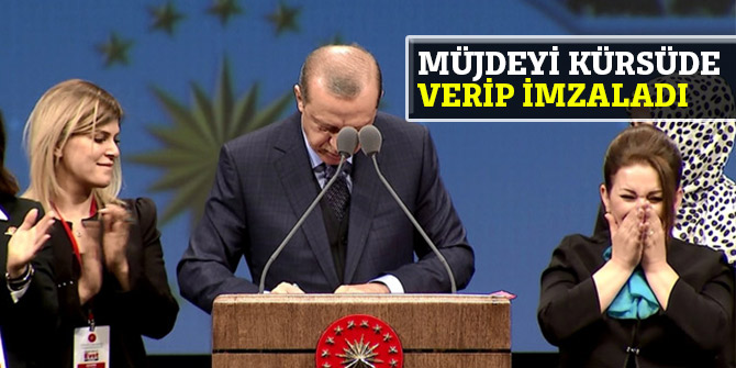 Müjdeyi kürsüde verip imzaladı