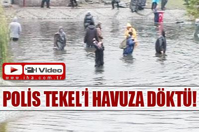 Polis işçileri havuza döktü 